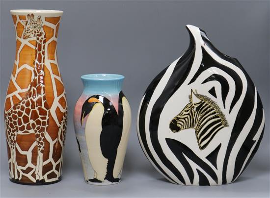 A Denis China Works giraffe vase and a penguin vase together with an Anita Harris studio zebra vase tallest 34cm